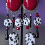 CHeetah print in black and white dangles with red accent clip on earring.