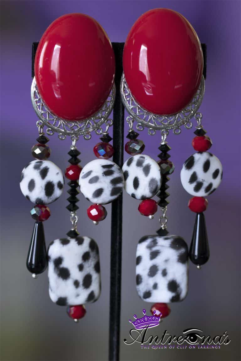 CHeetah print in black and white dangles with red accent clip on earring.