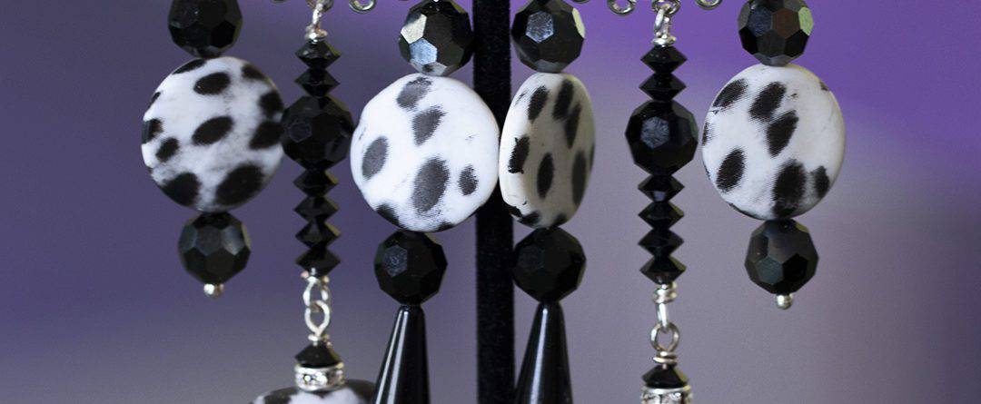 Long dangling black white cheetah clip on earrings.