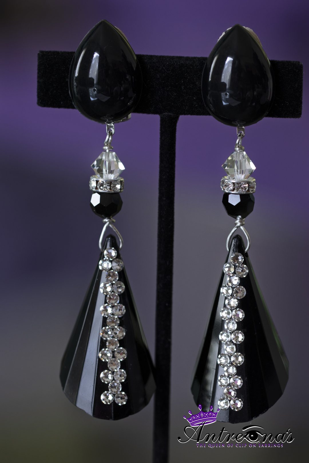 Blck cone drop clip on earring detailed with Swarovski elements.