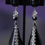 Blck cone drop clip on earring detailed with Swarovski elements.