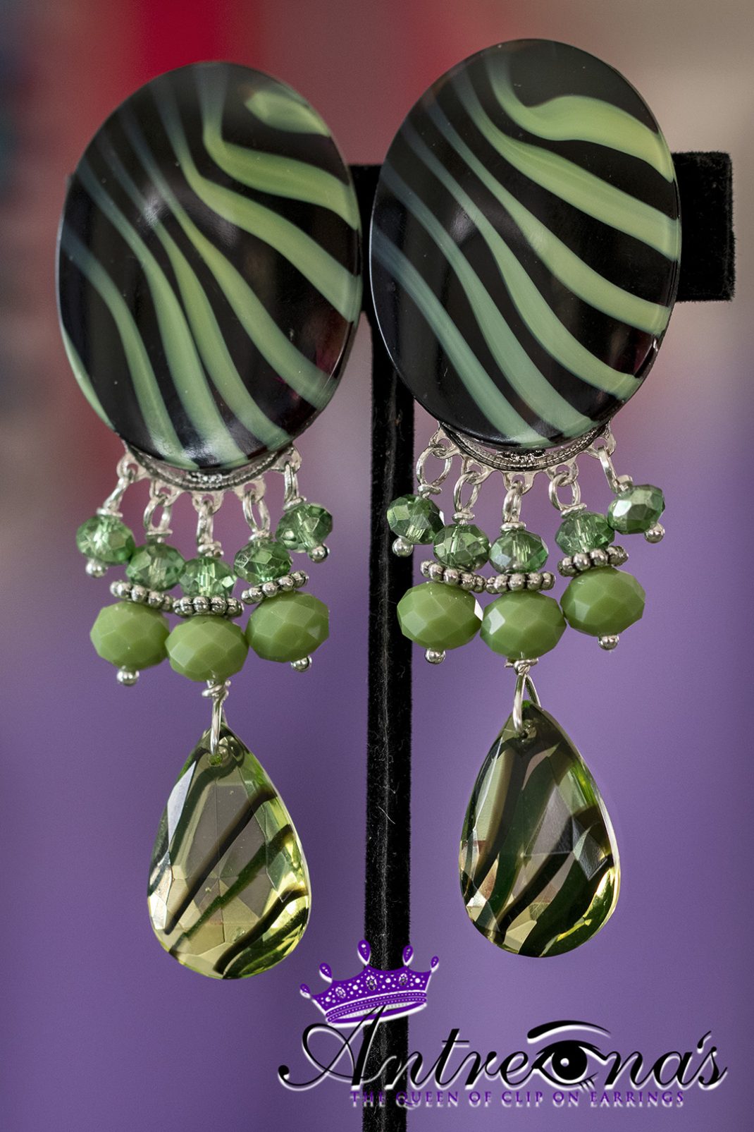 Green tiger clip on earrings