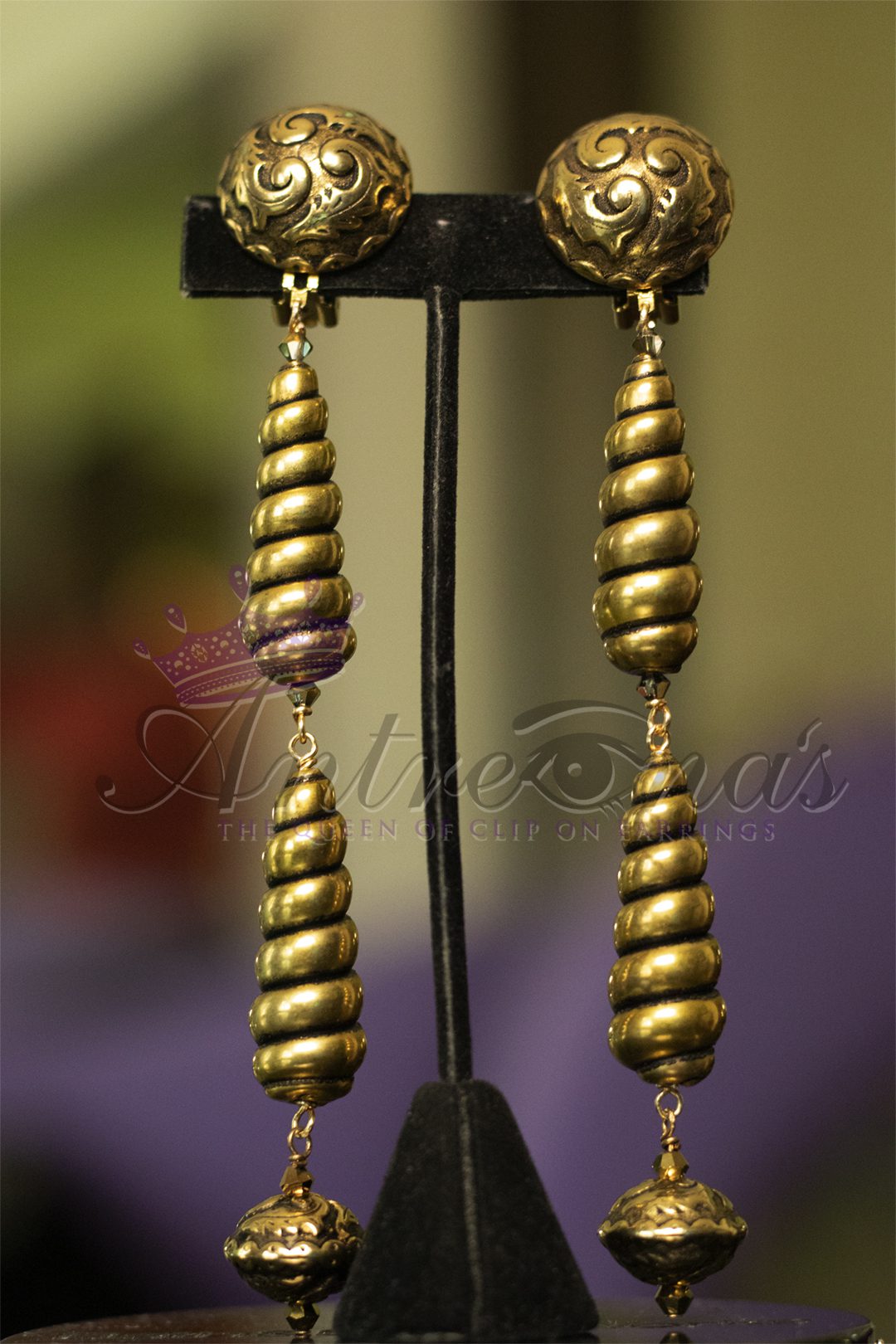 Image gold Long lightweight painless comfortable clip on earrings.