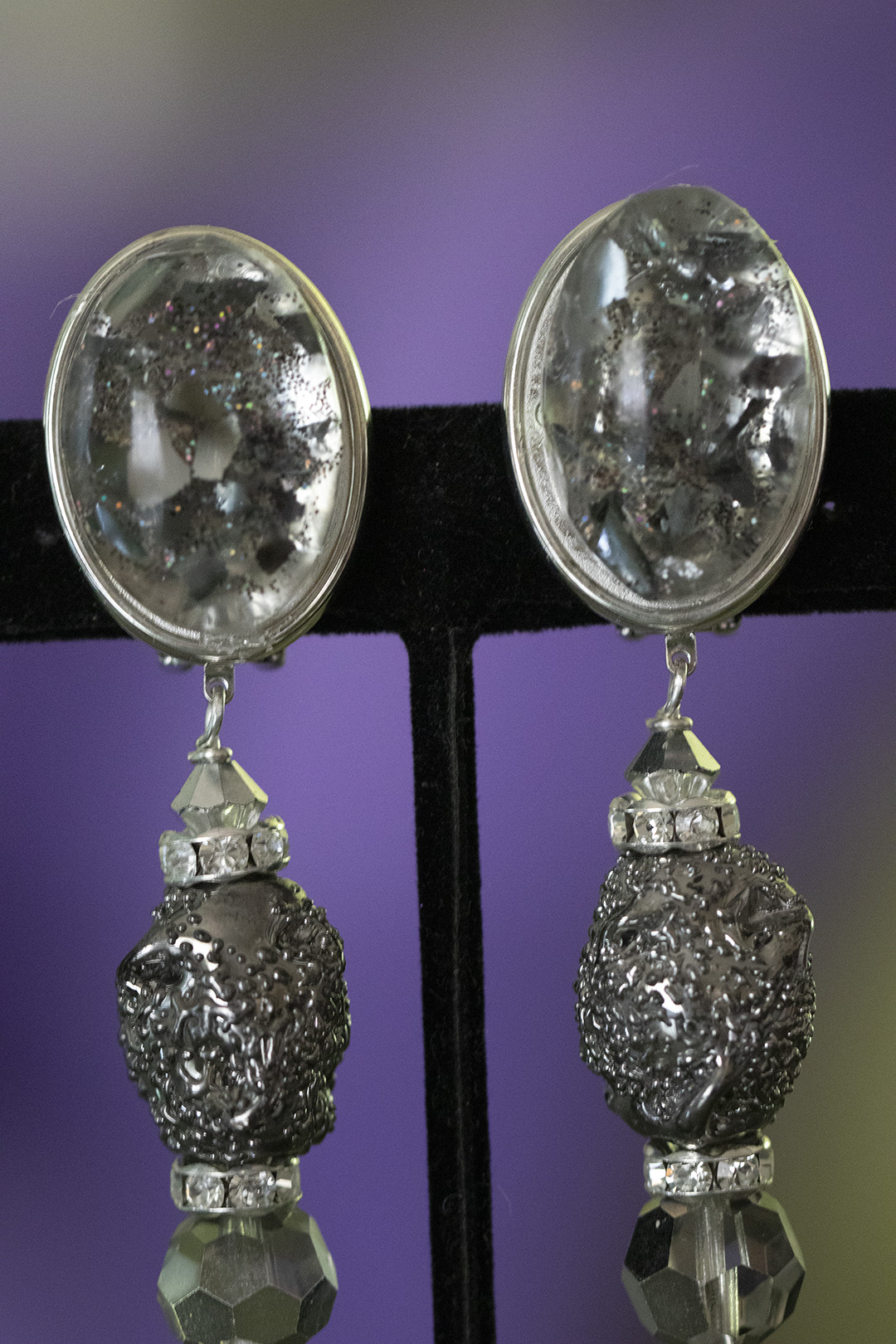 Comfortable clip earrings with a decorative transparent cab