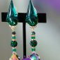 Emerald exotic comfortable clip on earrings with accenting colors on drop.