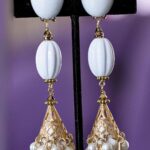 White long dangle clip on earrings.