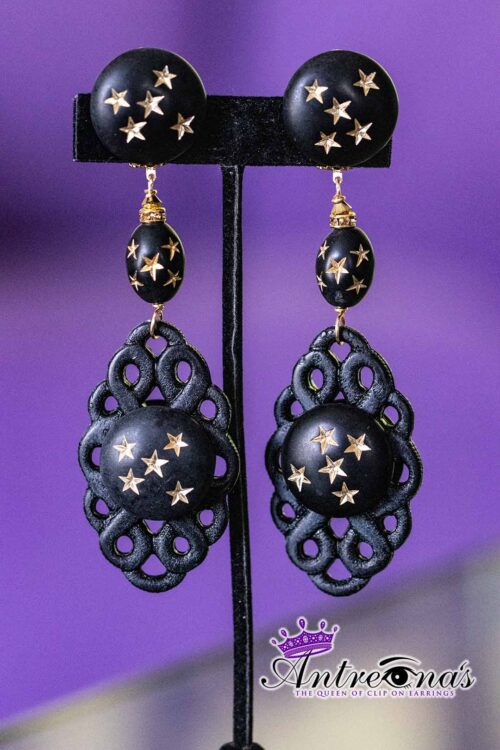 Astral Veil striking clip on earrings captures a celestial elegance through its striking use of black and gold
