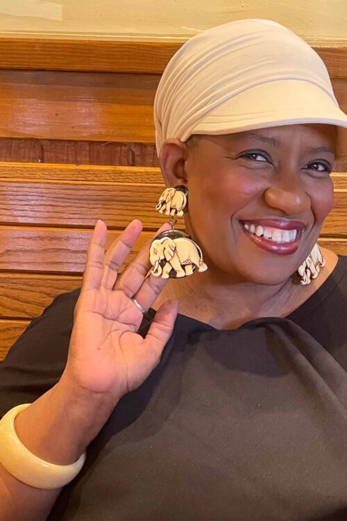 Customer with elephant comfortable clip-on earrings on her ears.