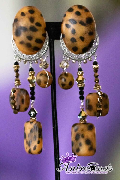 Leopard Luxe is a striking pair of comfortable pain-free earrings featuring a bold leopard print on an oval silver frame.