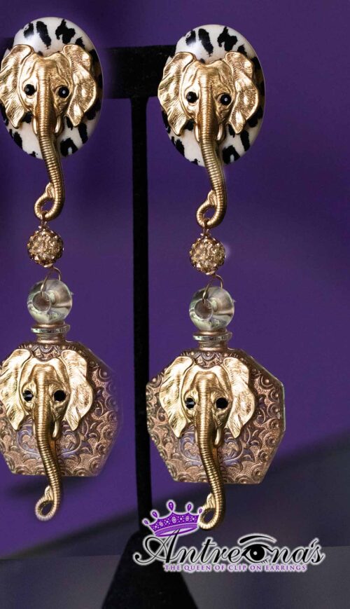 Golden Trunk Elegance is a pair of statement clip-on earrings that masterfully blend bold animal imagery with refined craftsmanship