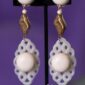 Pair of clip-on earrings designed to evoke a sense of elegance and confidence