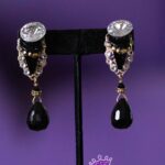 Teardrop Twilight is a refined pair of clip-on earrings that balances clarity and depth with graceful simplicity.