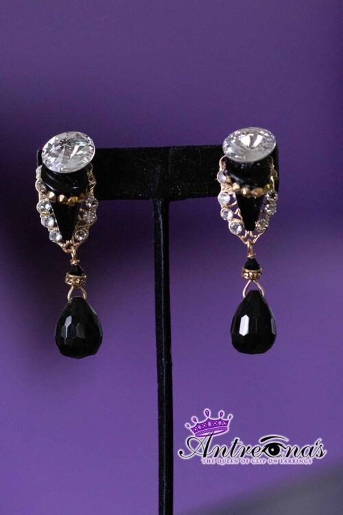 Teardrop Twilight is a refined pair of clip-on earrings that balances clarity and depth with graceful simplicity.