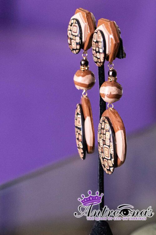 Earthbound Elegance is a pair of brown comfortable clip-on earrings.