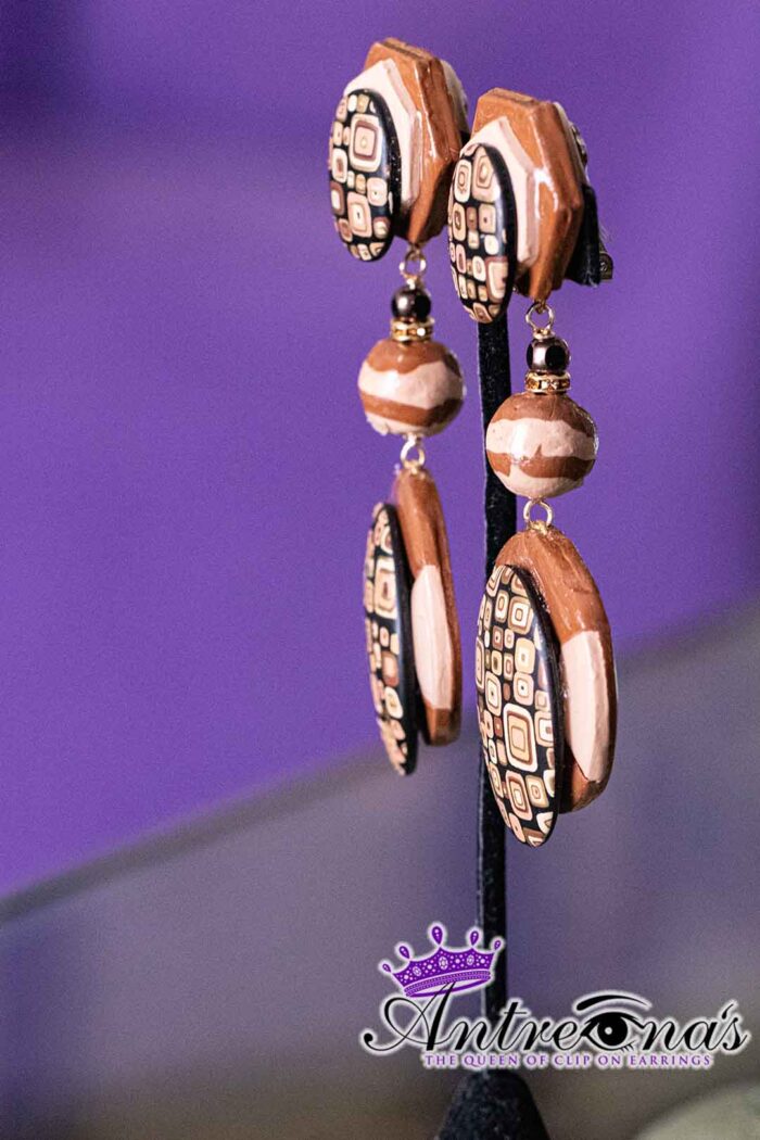 Earthbound Elegance is a pair of brown comfortable clip-on earrings.