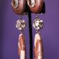 These clip-on earrings combine warm earthy tones with subtle sparkle, creating a quiet yet commanding presence.
