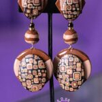 Earthbound Elegance is a pair of brown comfortable clip-on earrings.