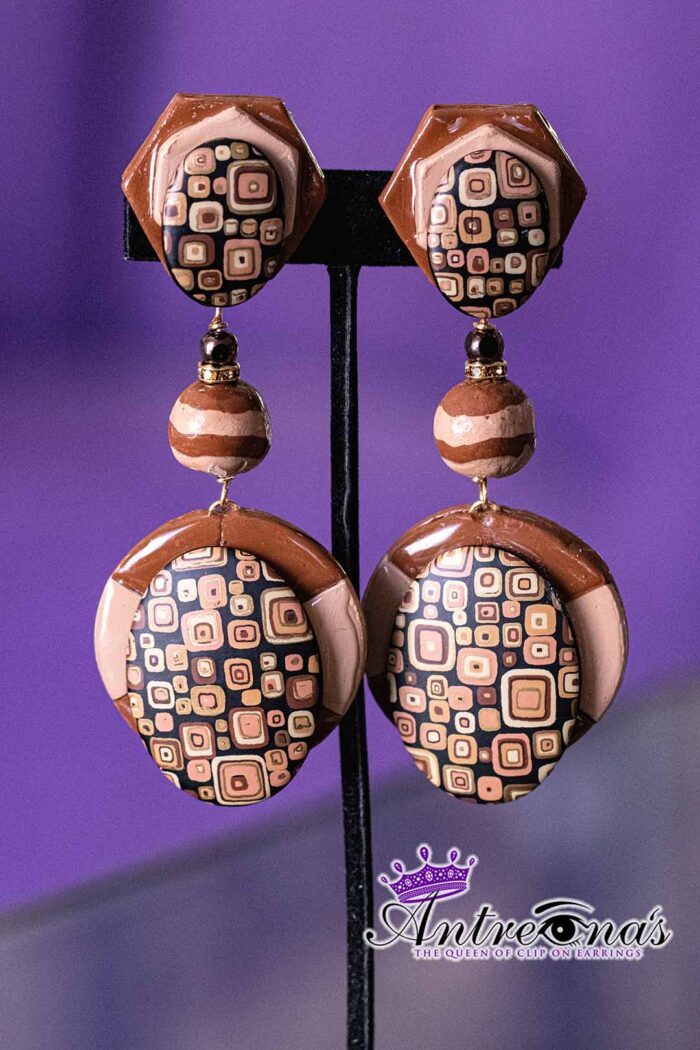 Earthbound Elegance is a pair of brown comfortable clip-on earrings.